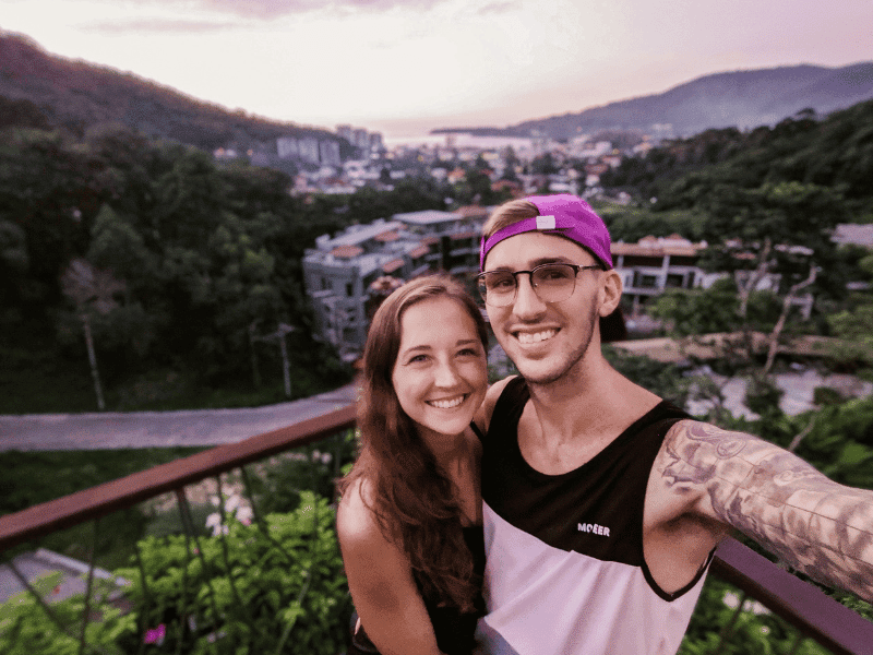 A couple takes a selfie from the Mala Restaurant balcony