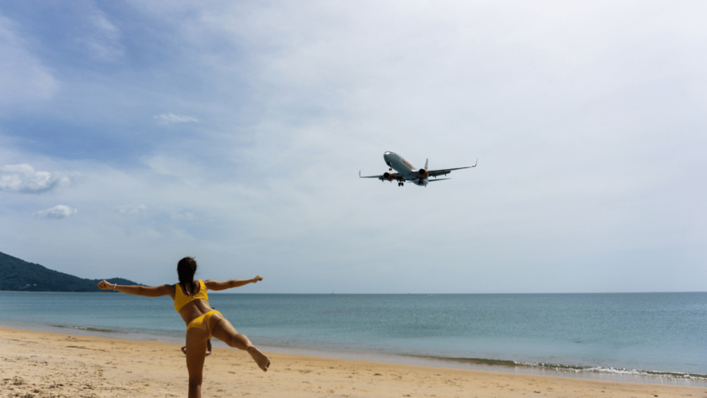 Mai Khao Beach's serene coastline with gentle waves lapping the shore, a peaceful retreat in Phuket