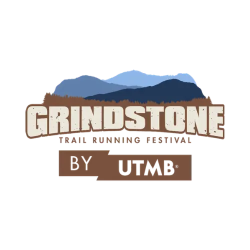 Grindstone Trail Running Festival by UTMB logo with bold lettering over layered blue mountain ridges and a forested horizon. The logo uses earthy browns and blues to reflect rugged trail terrain and endurance racing.
