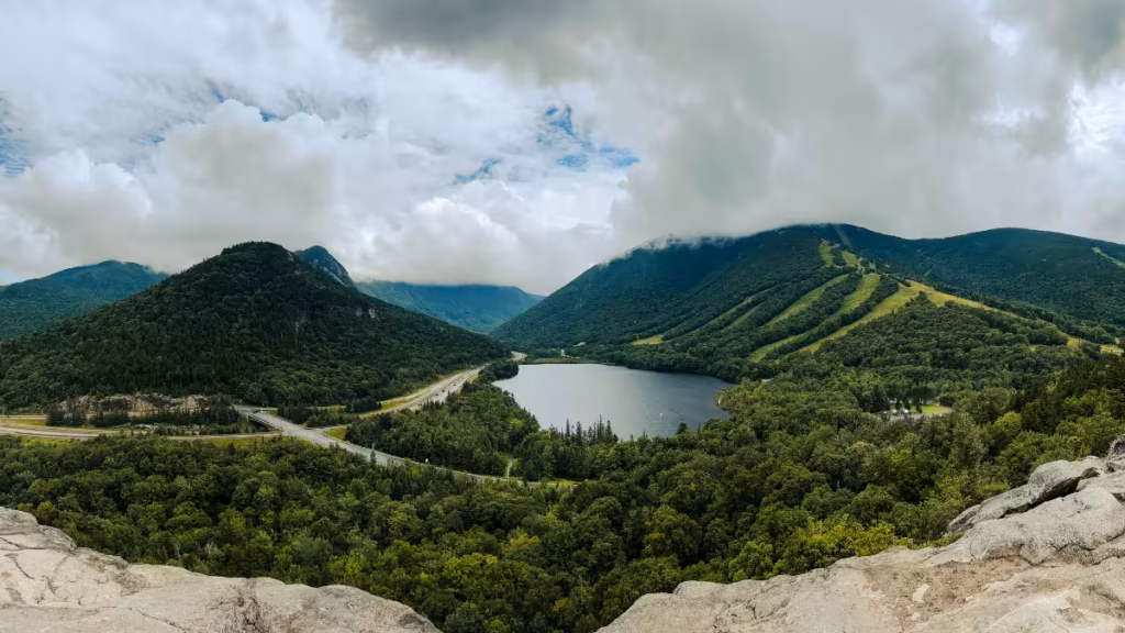 Echo Lake and the forested slopes of Cannon Mountain viewed from Artists Bluff Trail in New Hampshire.