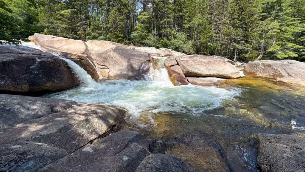 Rocky cascades and rushing water at Franconia Falls